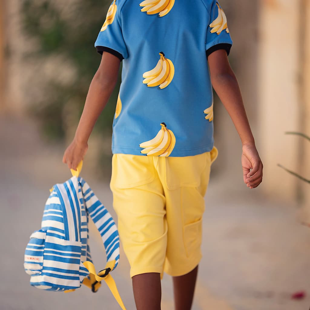 See-You-at-Six-Tissu-French-Terry-de-Coton-Imprime-Bananas-sur-le-Fond-Bleu-Mer-du-Belise-3.webp