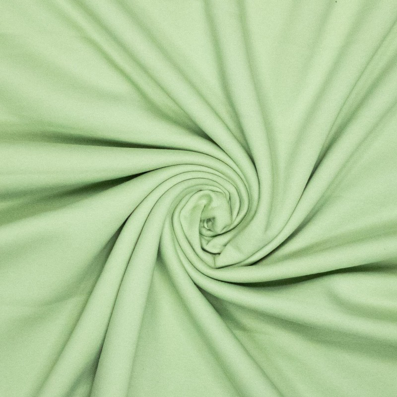 Sélection Coup de Coudre – Tissu Jersey Sweat de Coton Gratté Uni Couleur Vert Amande.webp